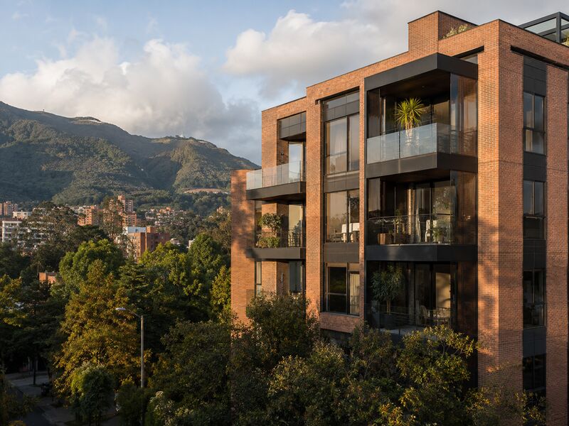 Brick apartment building in northern Bogotá with the eastern hills behind